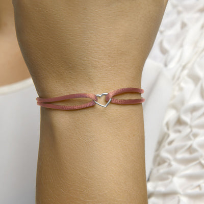 Basis | Oud roze gevlochten armband uitgevoerd met een gerhodineerd 925 zilveren hartje