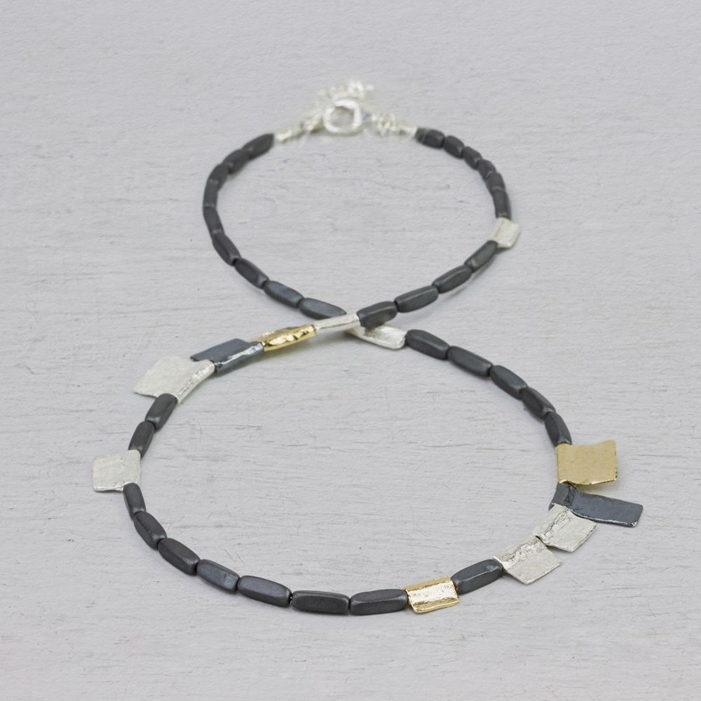 Jeh Jewels | Zilver collier met hematiet aangevuld met zilveren schakels. Deels geoxideerd en deels verguld