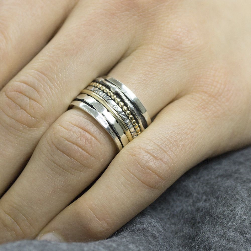 Jeh Jewels | Zilveren ring met losse bewegende ringen er omheen. Deels goldfilled en deels geoxideerd